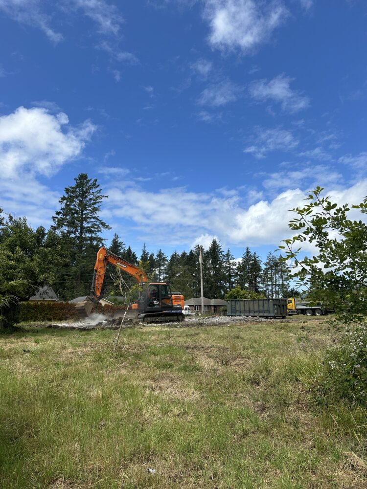Construction vehicle clearing future building site
